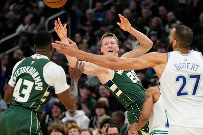 Feb 8, 2024; Milwaukee, Wisconsin, USA; Milwaukee Bucks guard AJ Green (20) passes the ball towards forward Thanasis Antetokounmpo (43) during the fourth quarter against the Minnesota Timberwolves at Fiserv Forum.